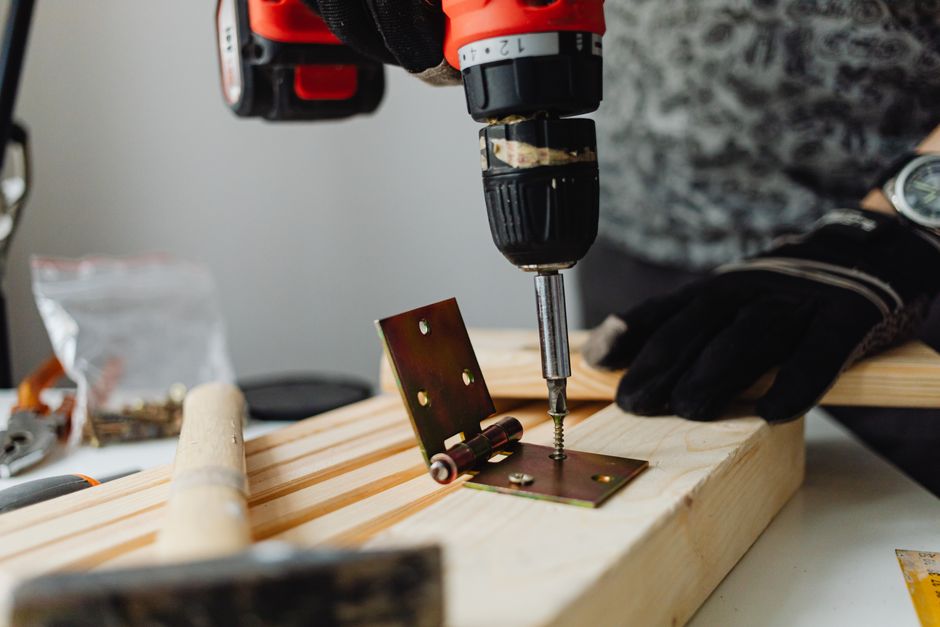 Carpenter measuring and installing an interior door
